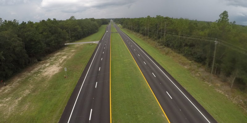 ariel photo of empty four-lane highway