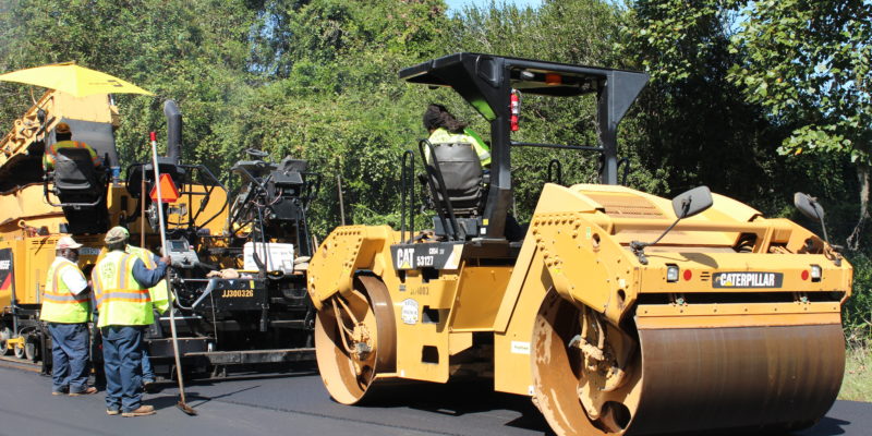 cwr contracting workers on paving equipment